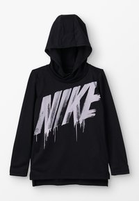 Musta huppari, jossa on iso, valuva hopeinen Nike-logo edessä. Valmistettu sileästä kankaasta, pitkähihaisena ja rentona istuvana.