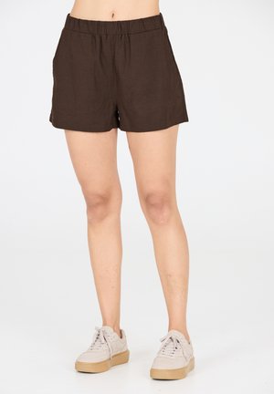 Shorts en lin léger de couleur marron avec une taille élastiquée et des poches latérales, présentant une coupe décontractée et une longueur qui s'arrête au milieu de la cuisse.