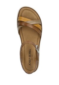 Brown and tan leather sandal with crisscross straps, adjustable buckle, padded insole, and light-colored outsole. Brand logo visible.