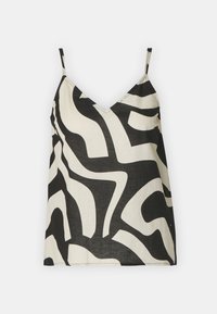 Top sans manches à motifs abstraits en noir et blanc avec des fines bretelles et un décolleté en V sur un fond uni.