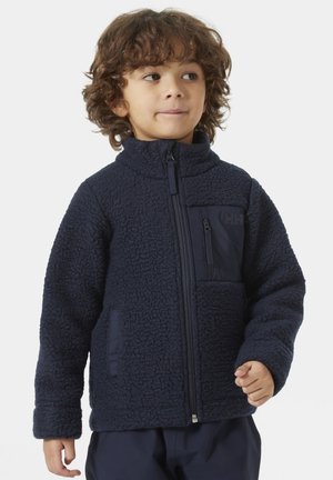 Chaqueta de forro polar azul marino con cuello alto, cierre de cremallera y bolsillo frontal. Tejido suave y texturizado con un detalle de bolsillo contrastante.