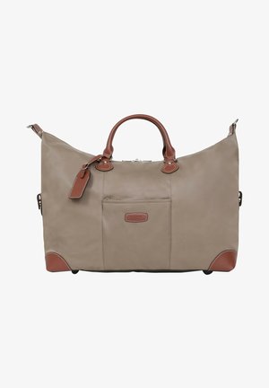 Grand sac de voyage beige avec des accents en cuir brun, poignées doubles et un compartiment zippé. Dispose d'un fond plat pour la stabilité.