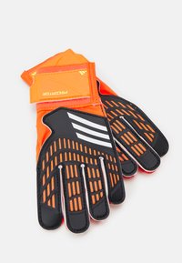 Guanti da portiere con un design arancione brillante e nero, palmi testurizzati con motivi antiscivolo e cuciture rinforzate per una maggiore durabilità.