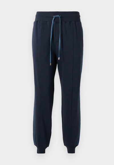 Mørkeblå joggebukser med elastisk midje, frontlommer, blå snøring, side-striper og ribbestrikkede mansjetter ved anklene.