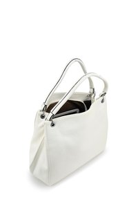 White leather handbag with a textured finish, black trim, two handles, and silver hardware. Open top design reveals a spacious interior.