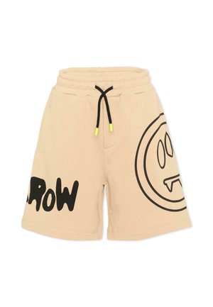 Shorts en coton beige avec taille élastique, cordons noirs à embouts jaunes, inscription noire "GROW" sur la jambe gauche, et un grand smiley noir avec des crocs sur la jambe droite.