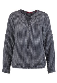 Blusa a maniche lunghe blu navy con motivi geometrici bianchi, colletto rotondo, chiusura con bottoni e orlo leggermente sagomato. Tessuto morbido con una leggera texture.