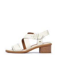White leather sandal featuring crisscross straps, a rounded toe, and a low wooden block heel with visible stitching around the sole.