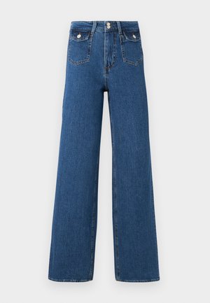 Farkkuhousut, joissa on leveät lahkeet ja tummansininen denim. Ominaisuuksiin kuuluu kaksi etutaskua ja napitus. Sileä pinta, jossa on näkyvät saumat ja rakenteellinen muoto.