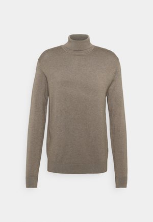 Beige coltrui gemaakt van zachte, gebreide stof. Heeft lange mouwen en geribbelde manchetten met een relaxte pasvorm. Geen zichtbare patronen.