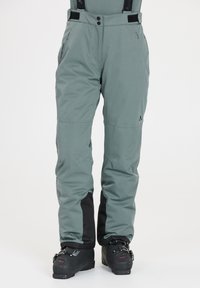 Vattentäta skidbyxor i en dov grön färg, med justerbara remmar, fickor med dragkedja och svarta detaljer vid muddar.
