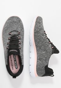 Black and gray athletic shoes with a textured fabric upper, pink accents, and white cushioned sole, featuring a memory foam insole and elastic laces.