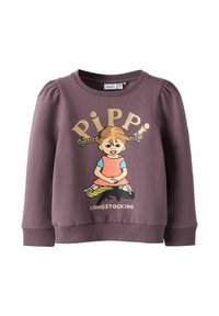 Felpa viola con una grafica colorata di Pippi Calzelunghe. Tessuto morbido con maniche a sbuffo e polsini a costine. Dettaglio in testo glitterato.