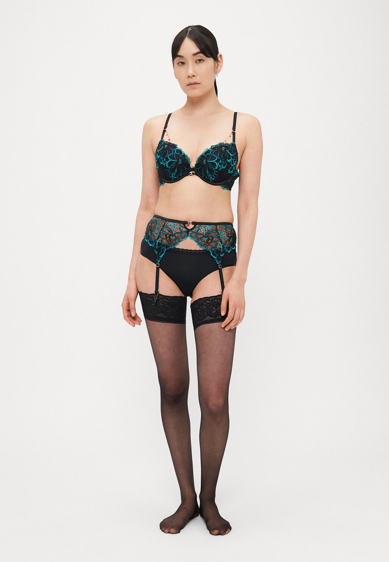 Ann Summers - Imbracatura nera in pelle sintetica con frange | ASOS