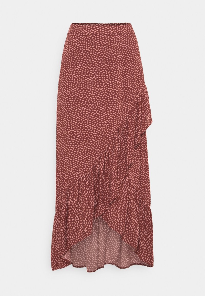 Jupe midi couleur rouille avec petit imprimé floral blanc, détail à volants asymétriques et ourlet haut-bas.
