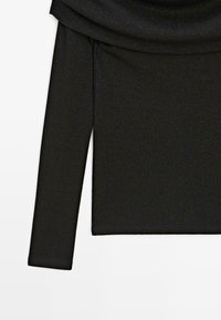 Schwarzes Langarmoberteil aus geripptem Stoff mit einem drapierten Ausschnitt und einer glatten, strukturierten Oberfläche, ideal zum Kombinieren.