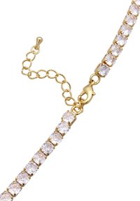 Armband in Goldoptik mit runden, klaren Kristallen in einem linearen Design. Enthält einen sicheren Karabinerverschluss und eine verstellbare Kettenverlängerung.