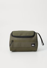 Olive green rectangular toiletry bag with black zipper, front pocket, and fabric wrist strap on plain white background.