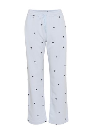Pantaloni azzurri chiari realizzati in tessuto morbido, con una vestibilità comoda, vita elastica con cordoncino e motivo a cuori neri sparsi.