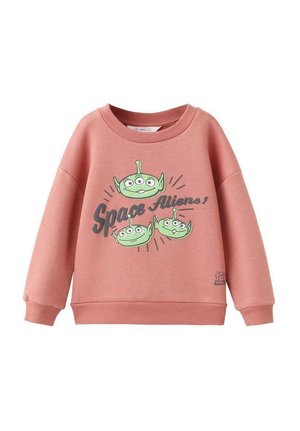 Sweat-shirt rose à encolure ronde, manches longues. Présente un motif de trois extraterrestres verts avec le texte « Space Aliens ! » en gris.