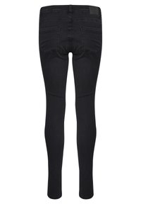 Jean skinny noir vu de dos avec deux poches arrière et une ceinture avec passants, présenté sur un fond blanc.