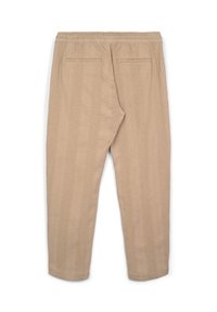 Pantalons beiges texturés avec taille élastique et deux poches passepoilées au dos, présentés à plat sur un fond blanc.