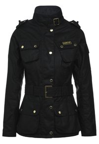 Black canvas jacket with high collar, belt, and golden buttons. Features two chest pockets and side pockets. Barbour logo on upper left.