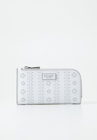 White leather wallet featuring laser-cut floral designs and perforations, silver-tone hardware, and a top zipper closure.