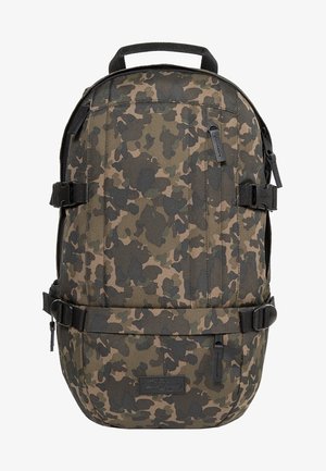 Zaino mimetico realizzato in un tessuto resistente, caratterizzato da una forma arrotondata, molteplici cinghie e scomparti con zip per un'organizzazione ottimale.