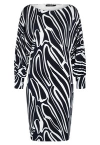Robe à motif bleu marine et blanc avec des manches surdimensionnées, présentant des rayures abstraites et ondulées. Fabriquée en tissu doux, de conception mi-genoux.