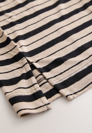 Langærmet skjorte med beige og sorte striber, der har en løs pasform, blødt bomuldsstof og sideslidser ved kanten for bedre bevægelsesfrihed.