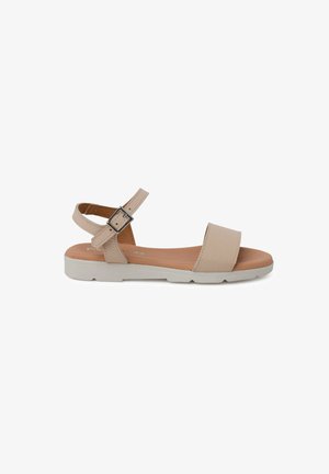 Beige odinė šlepetė su plačia juostele ir reguliuojamu kulkšnies užsegimu. Balta guma padais. Minimalistinis dizainas, plokščias profilis, lygus paviršius.