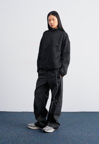Nike Sportswear Treniņtērpa apakšdaļas - black