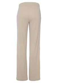 Beige Ripp-Hosen mit elastischem Bund, im geraden Schnitt und aus weichem, strukturiertem Material. Keine sichtbaren Taschen oder Details.