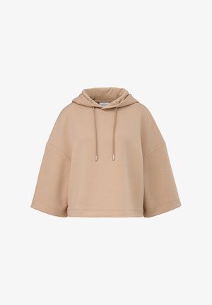 Beige cropped hoodie with a wide, boxy fit, large hood, and drawstrings. Features soft, textured fabric and short sleeves.