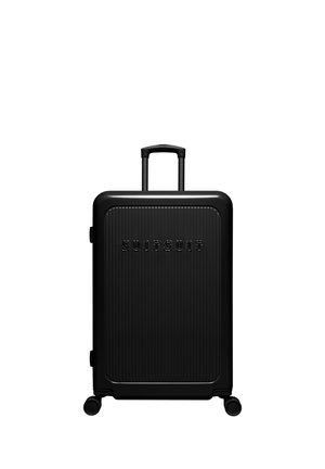 Black hard-shell suitcase with vertical ridges, raised "SUITSUIT" logo, telescopic handle, and four spinner wheels.