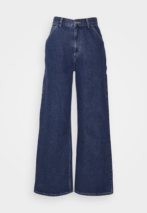 Housut tummansinisestä denimmateriaalista, joissa on leveät lahkeet ja korkea vyötärö. Edessä taskut ja vetoketjulla suljettava metallinappi. Tasainen pinta ja klassinen muotoilu.