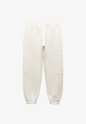 Białe dresy z elastycznym pasem, zwężanymi mankietami i dwoma kieszeniami z przodu. Wykonane z miękkiej tkaniny o gładkiej strukturze.