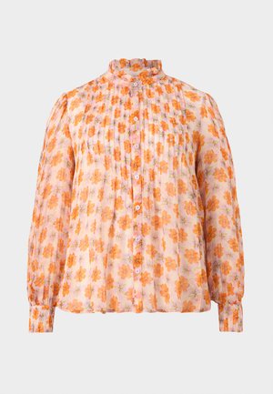 Blouse à manches longues avec boutons, col à volants, en tissu rose translucide orné de motifs floraux orange.
