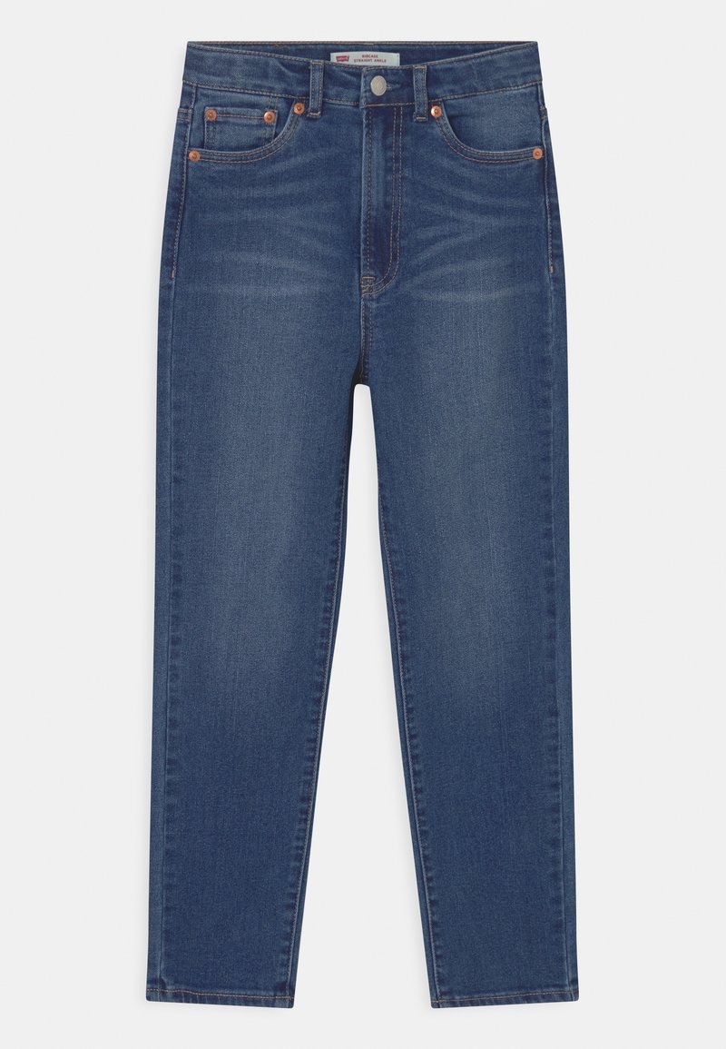 Jean en denim bleu foncé avec une coupe droite, des accessoires en cuivre, cinq poches et une légère décoloration.