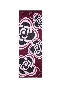 Asciugamano in spugna con uno sfondo bordeaux e grandi motivi geometrici neri e bianchi contornati di rosa chiaro. Texture morbida con accenti stampati.