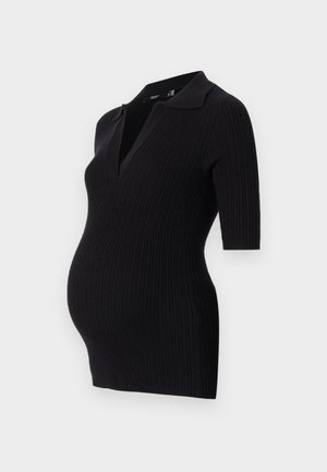 Black ribbed maternity dress with a short polo collar and short sleeves, designed to accommodate a growing belly.