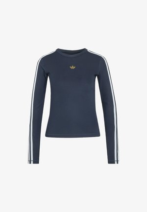 Granatowa bluzka z długim rękawem wykonana z miękkiego materiału, z białymi paskami na rękawach oraz małym złotym logo na piersi.