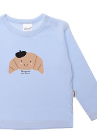 Langärmliges hellblaues Shirt mit einem Croissant-Graphic und einem schwarzen Barett sowie dem Text "Bonjour mon amour" darunter.