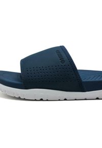 Sandale à glissière bleu marine avec empeigne perforée, en matériau doux, et semelle extérieure en caoutchouc blanc. Comprend un détail de logo et une semelle intérieure ergonomique.