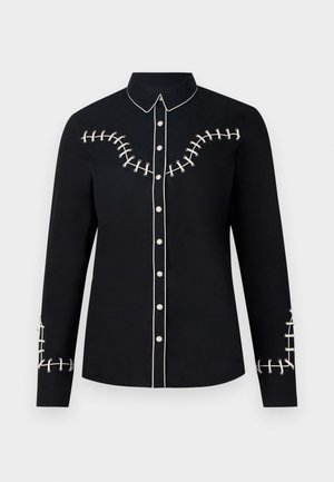 Must mustaga kätistega särk, millel on kontrastset valget õmblust detailid rinnal ja varrukatel. Sile kangastekstuuri.