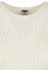 Ribbed, cream-colored top with a round neckline. Features a tag reading "URBAN CLASSICS," size XS, made in Bangladesh.