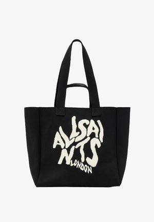Black canvas tote bag featuring bold white "ALLSAINTS LONDON" lettering, dual handles, and a spacious rectangular design.