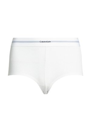 Bílé žebrované bavlněné trenýrky s elastickým páskem v šedém odstínu, na kterém se nachází logo Calvin Klein v černé barvě. Jednoduchý a přiléhavý design.