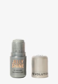 Jelly Shine highlighter i grå emballasje med glitrende topp. Teksten inkluderer "JELLY SHINE" og "EYE, FACE & BODY" i oransje og grå.